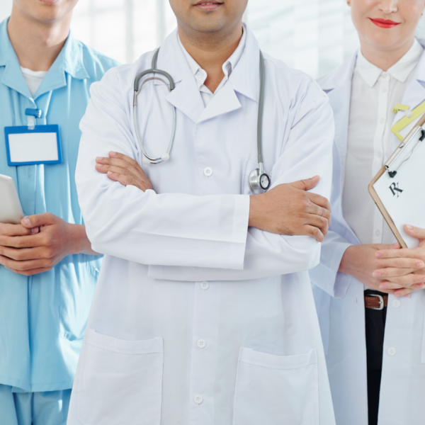 Three medical doctors are standing